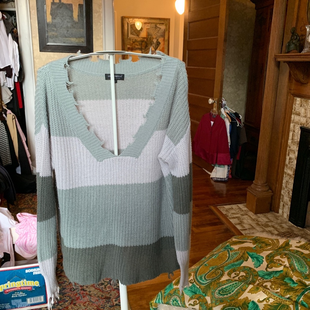Simply southern cut‎ fringed distressed sweater. Worn once.